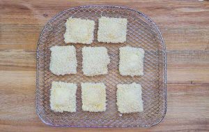 The prepped ravioli on the air fryer tray, ready to cook.