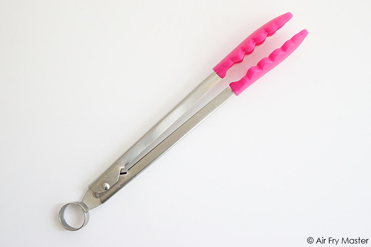 Metal tongs with silicon tips, which are perfect for air frying.