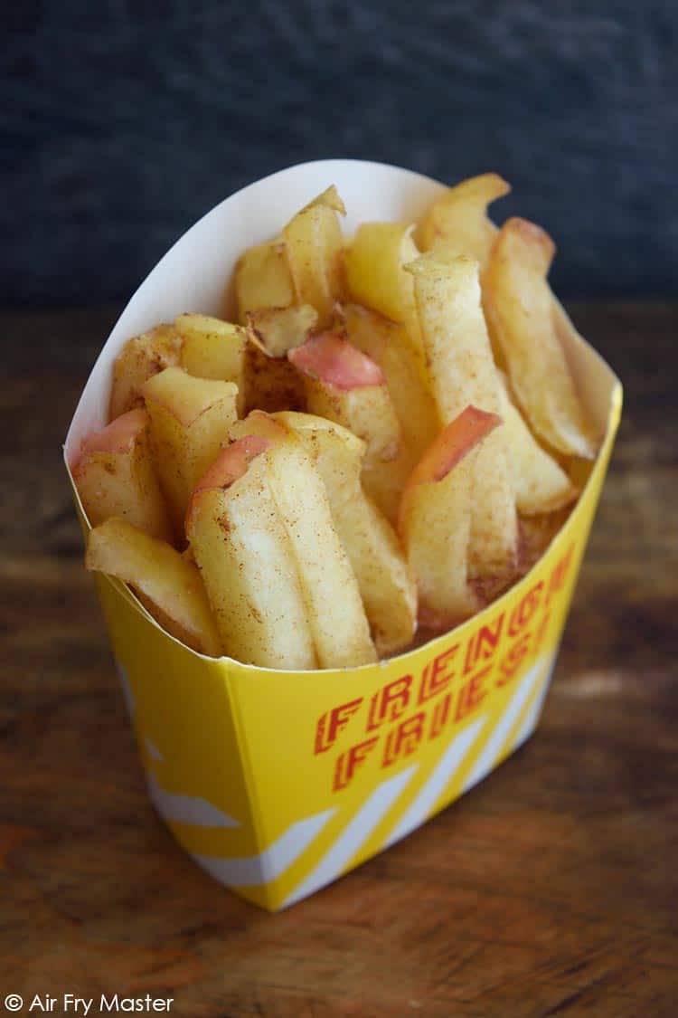 Air Fryer Apple Fries stuffed into a french fry carton.