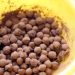 Air Fryer Crunchy Cocoa Chickpeas in a yellow bowl.