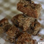 Air Fryer Granola Bars stacked on a checkered cloth.