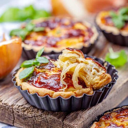 Caramelized Onion Quiche in tart pans.