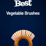 A single vegetable brush sits on a dark blue background.