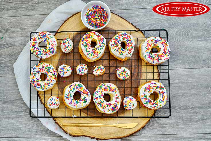 Sprinkled sprinkled over the frosted donuts from this air fryer donuts recipe.