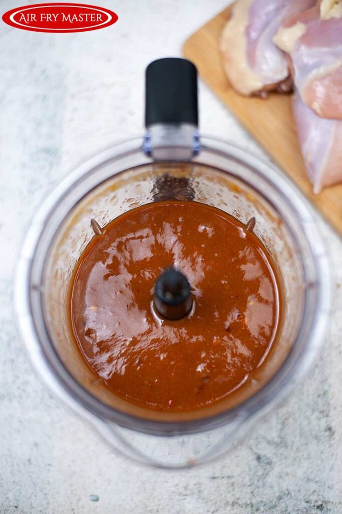 The Air Fryer Huli Huli Chicken sauce blended and sitting in a blender cup.