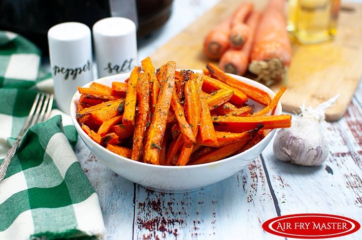 A bowl of just finished Air Fryer Carrot Fries.