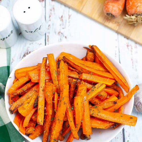 A white bowl filled with Air Fryer Carrot Fries