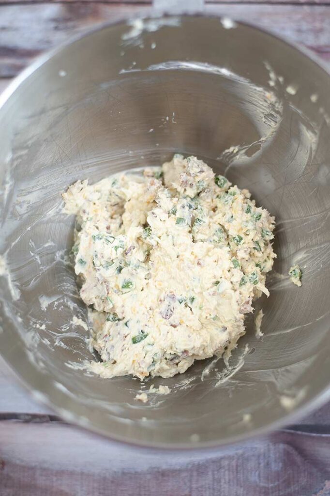 The Air Fryer Jalapeño Popper Bites dough mixed together in a stainless steel mixing bowl.